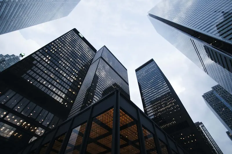 Illustrative stock photo of glass office towers seen from below, not a property in St. John's