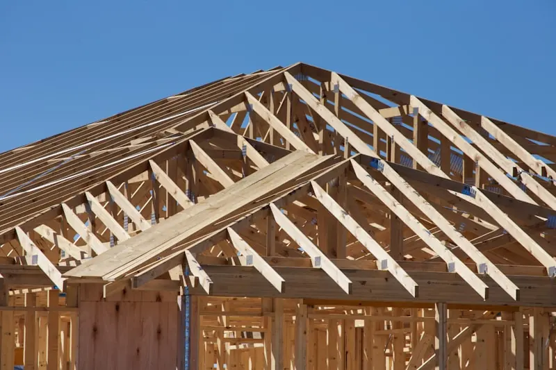 Wood-frame roof trusses on a house under construction